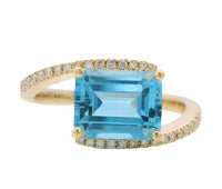 14K Yellow Gold 3.08ct Blue Topaz & 0.13cttw Diamond Ring