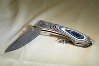 Hemi Hand Carved SS Inlaid with Fordite, Blade Intrepid Damascus, Kashmir Blue Topaz, 015/100 by William Henry