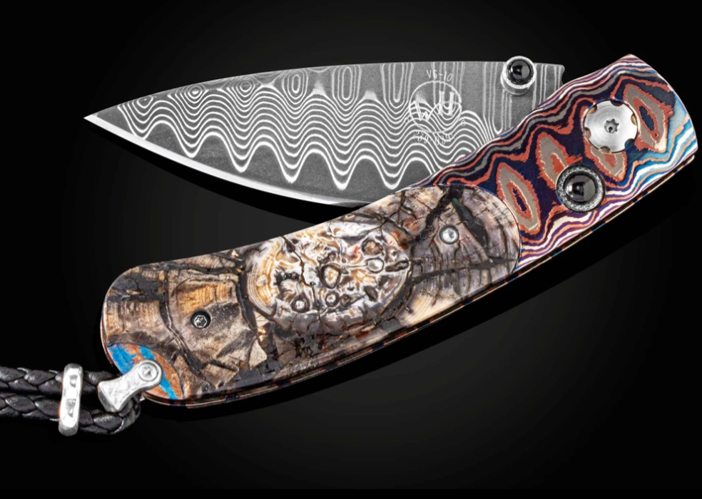 Kestrel Aura Features Wave Mokume Inlaid With Woolly Mammoth Tusk with Wave Damascus Blade by William Henry